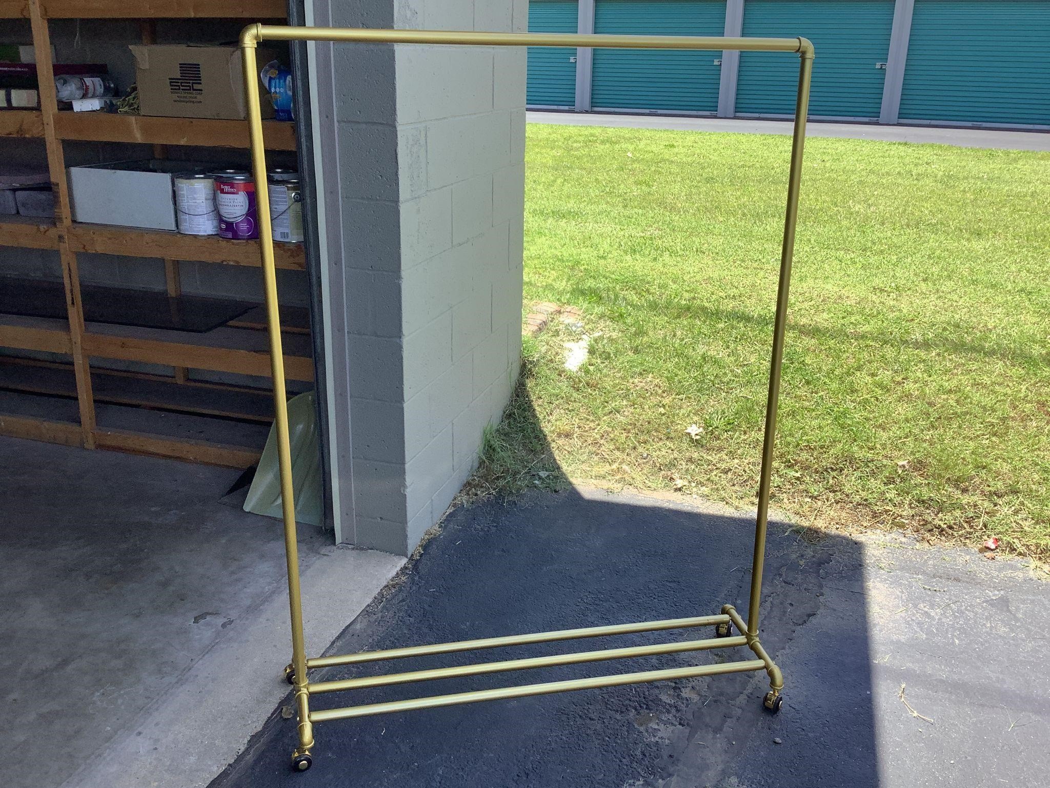 gold rolling clothes rack 62 x 47