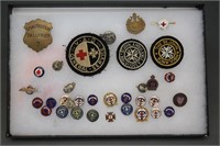 ~90 items, in 2 display cases. Lapel pins, etc.