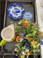 Decor plates, pitcher, flower arrangement