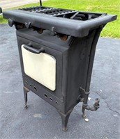 antique gas stove- see broken burner grate