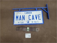 Metal man cave sign and Buffalo watch
