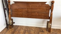 Queen size bed frame with solid wood headboard.