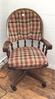 Wooden desk chair on wheels with custom cushions.