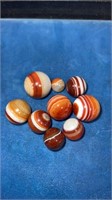 9 Bullseye agate marbles very good condition