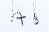 Two sterling silver necklaces and pendants