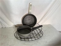 2 saucepans and metal carrier