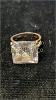 Ring with large clear stone marked witha "J"