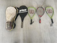 Three racquetball rackets, one tennis racket, and