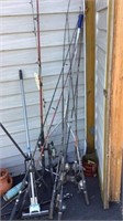 Fishing poles & net, yard rake, small tire,