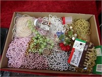Flat of vintage strings of beads.