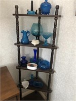 Corner shelf with contents of blue glass