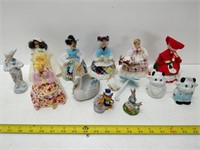 lot of doll figurines and cow figures