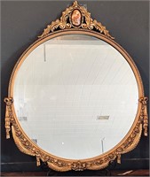 Antique wooden framed mirror with medallion