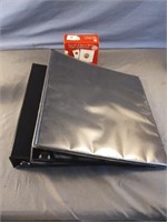2 binders with coin holders and an opened box of