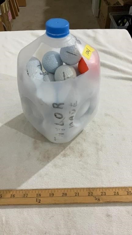 Milk jug full of golf balls