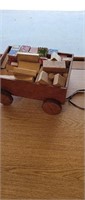 Wooden wagon full of vintage wooden letter number