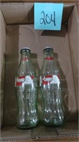 (2) 8 oz Season Greeting Coca Cola Bottles