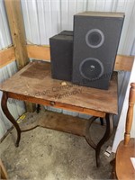 Wood table with 4 speakers.