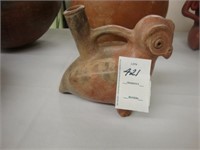 Clay animal effigy vessel.