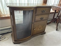 Lighted curved front cabinet