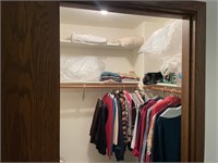 Closet of Woman's Clothing, Bedding Items, Racks