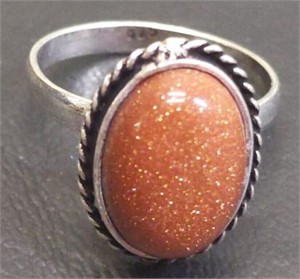 Size 7.5 ring with brown tone stone