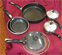 Assortment of saucepans, strainer, omelet maker
