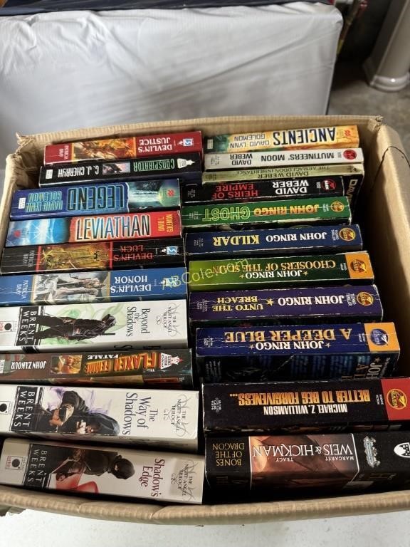 Large box filled with Jim Butcher paper back