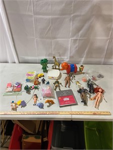 Assorted toys, action figures, matchbooks