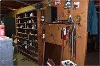 Wall of assorted hardware and supplies; as is