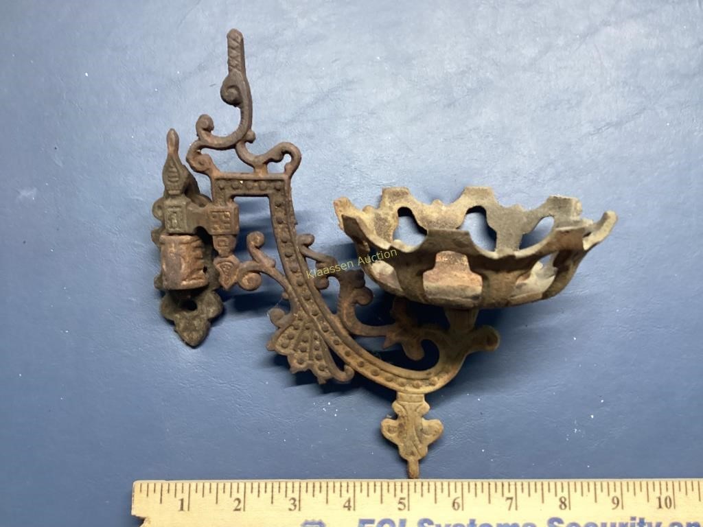 Antique cast iron wall bracket for an oil lamp