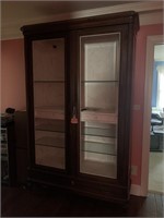 Large display case with glass doors and 3 glass