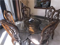 Carved wood dining table with glass top & 6 chairs