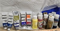 Group of partially used acrylic paints