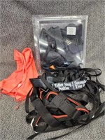 Tether straps and orange vest.  Look at the