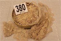 BASKET OF LACE DOILIES