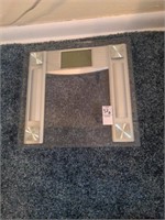 Glass and plastic bathroom scale