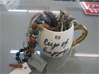 Cup of Happy Mug Full of Costume Jewelry