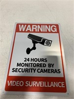 "WARNING 24 HOURS MONITORED BY SECURITY CAMERAS
