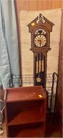 Grandfather clock rug on wall, shoe rack, shelf