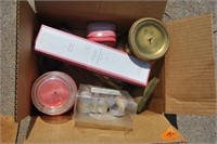 box of candleholders and candles