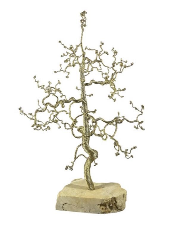 A Free Formed Metal Tree on Stone Base