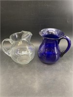 Lot of 2 water pitchers: cobalt blue and clear