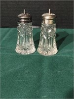 Antique cut glass S & P's. Tops are silverplate.