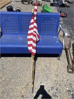 2 flag poles w/ American flags