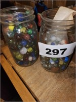 2 GLASS JARS OF MARBLES