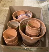 Large box full of terra-cotta pots includes two