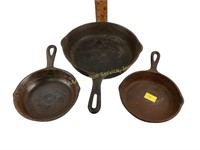 Cast iron skillets 9 3/4in,  3, 3, some rust