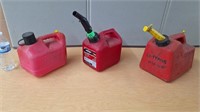 3 PLASTIC GAS CANS W/NOZZLES- 2- 1 GAL & A 1.5 GAL
