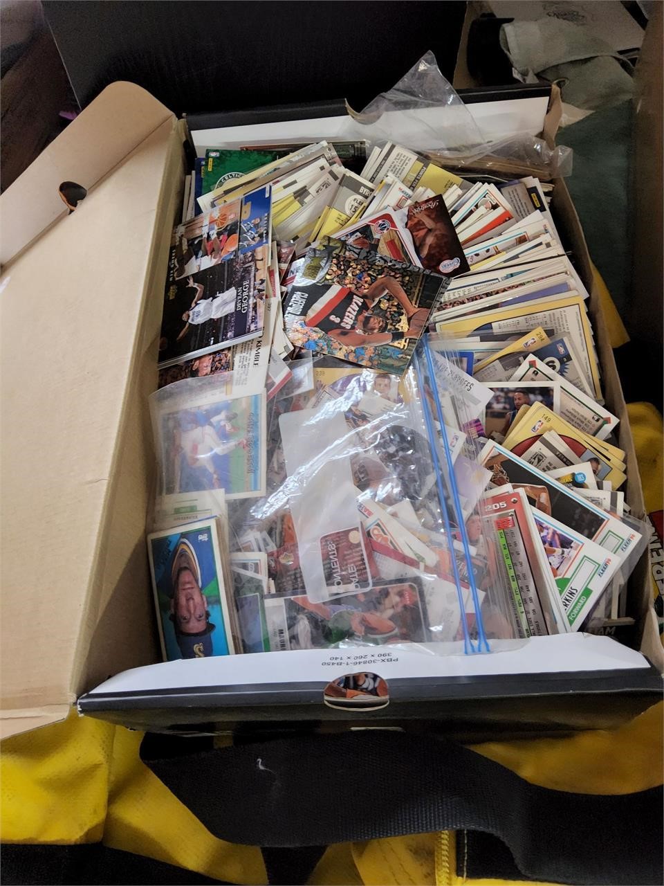 shoe box of sports cards